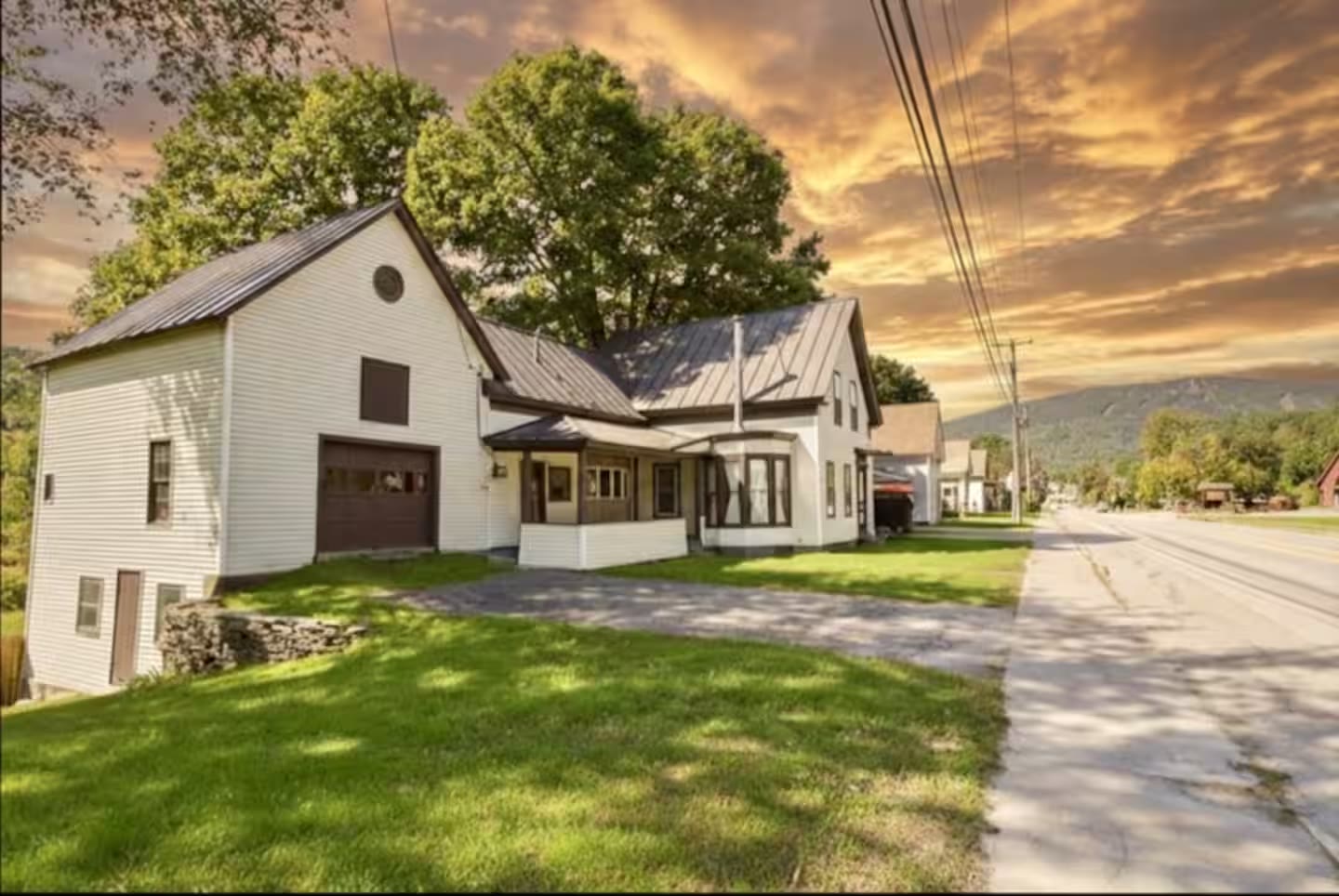 Exterior of The Bear's Den at 56 Main Street, Ludlow, Vermont at golden hour